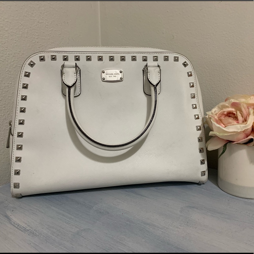 Michael Kors white studded handbag.